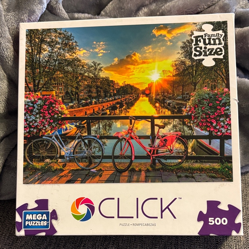 *3 Puzzles for 20
Click 500-Piece Puzzle - Vibrant Sunset with Bicycles